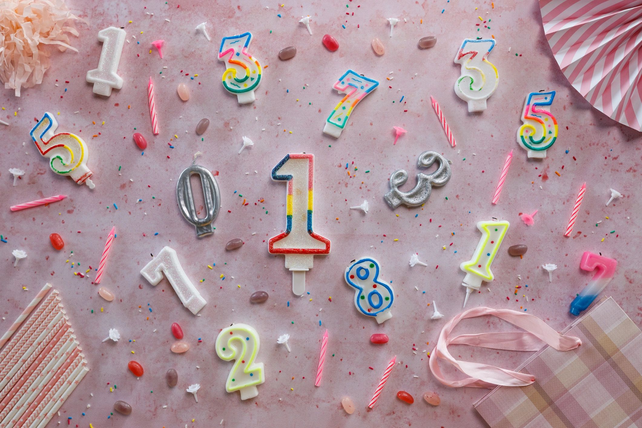 Birthday candles and party accessories flat lay