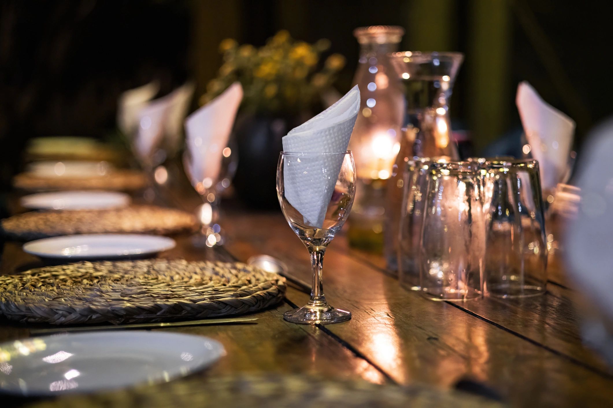 Elegant neutral-toned event table styling with candlelight