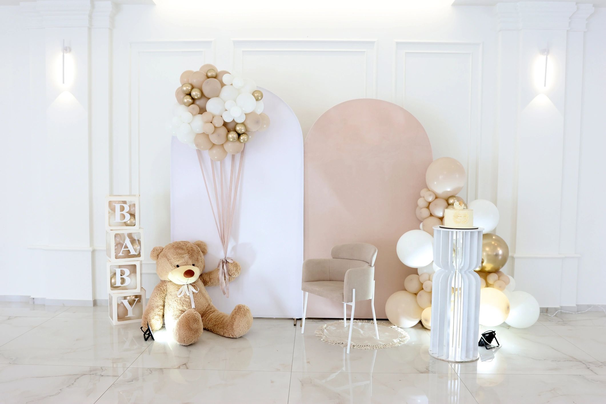Children’s celebration decor with balloon cluster and teddy bear